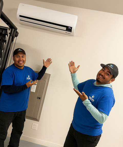 Two experienced technicians from Legend Air finish the installation of a ductless HVAC system