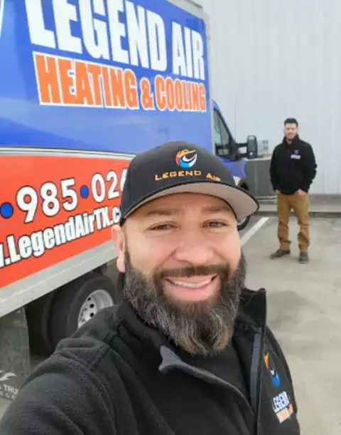Owner Jason Melendez posing with a Legend Air truck and one of his trusted crew members.