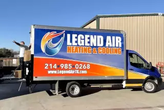 Legend Air HVAC installation technician, standing at the back of the truck excited to begin an air conditioner installation.